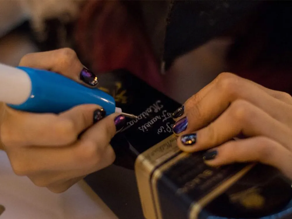 Live calligraphy and engraving at a luxury event